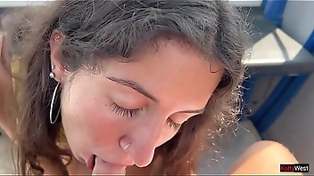 Beauty sucks cock on a Ferris wheel in an amusement park